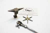 EXQUISITE SET OF EARLY JEWELLERS STAKE ANVIL, HAND VISE AND WATCH KEY