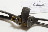 FINE SNELL & ATHERTON CAST IRON AND BRASS CURVED LEATHER SHAVE