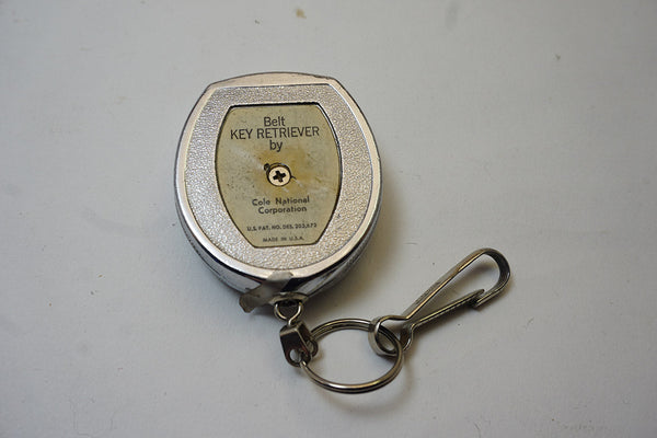 VINTAGE ADVERTISING KEY HOLDER WITH CLIP - COLE NATIONAL CORPORATION