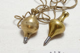 TWO SWEET BRASS PLUMB BOBS